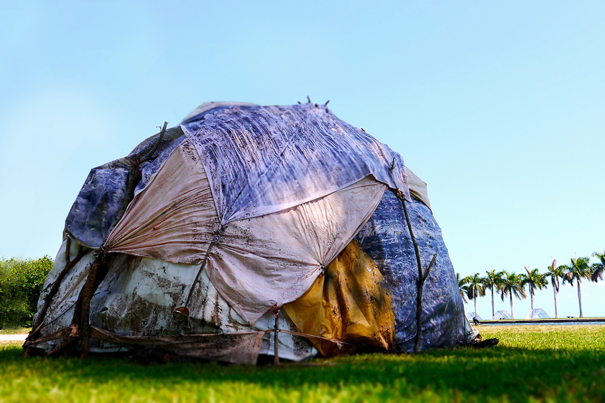 The Famished Road, 2016, Found Objects and Photos on fabric. 15 feet x 15 feet